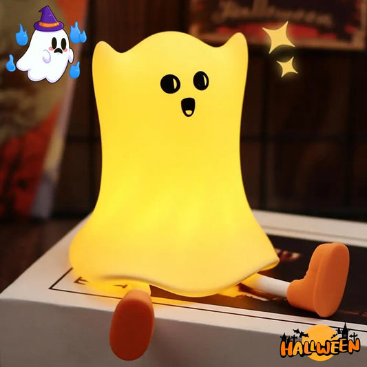 Yellow ghost plush toy with orange shoes on a surface, with Halloween theme elements.